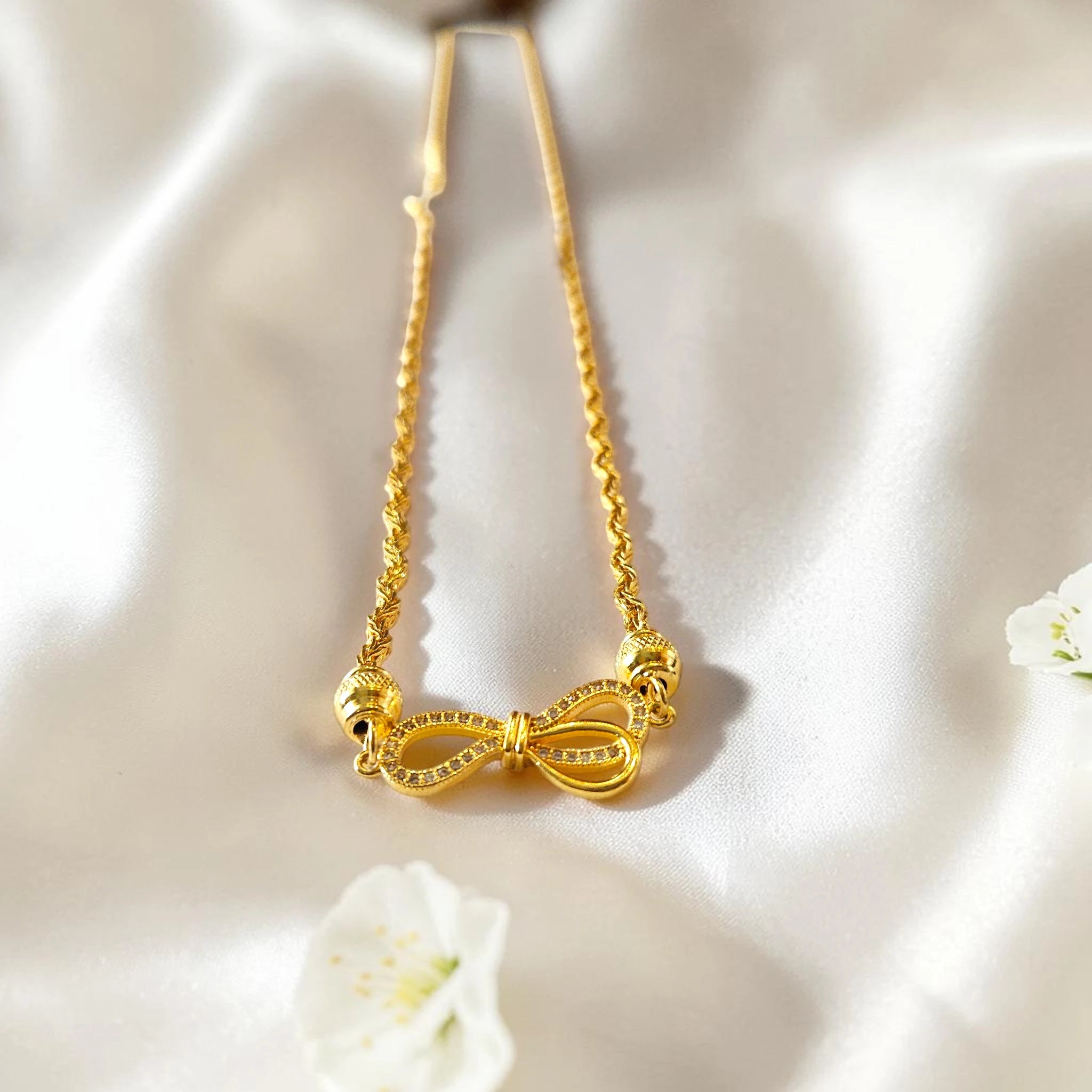 Shangri 30 Inch Gold Plated Chain Necklace with AD Stone Bow Motif