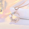 Rose Gold Plated American Diamond Studded Moon Shape Contemporary Pendant Necklace
