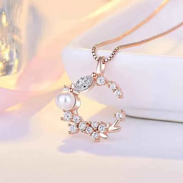Rose Gold Plated American Diamond Studded Moon Shape Contemporary Pendant Necklace