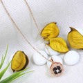 Stainless Steel Gold/Rosegold Plated Floral Spinning Pendant Necklace