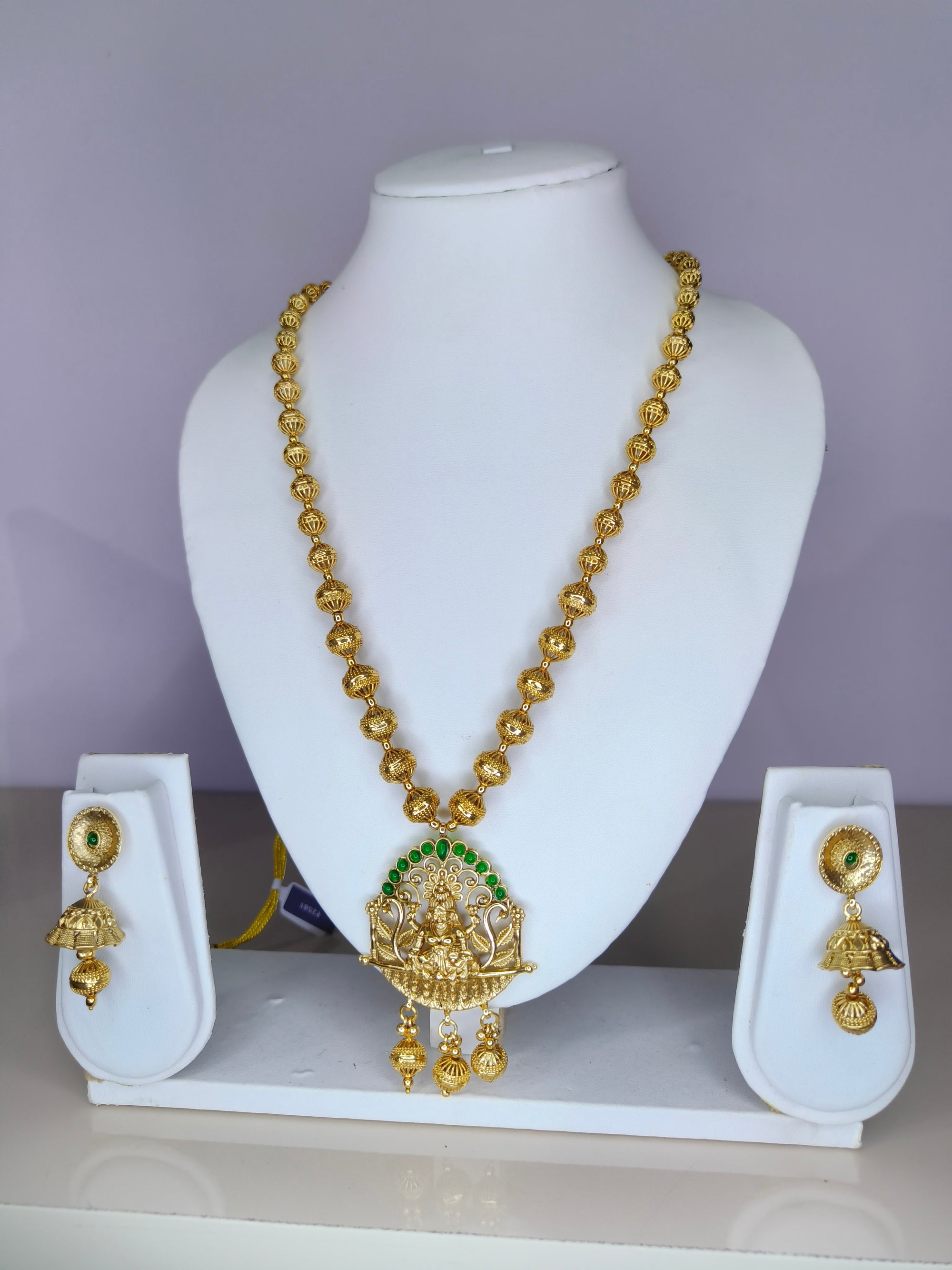 Gold Plated Lakshmi Temple Necklace Set with Green Stone Accents
