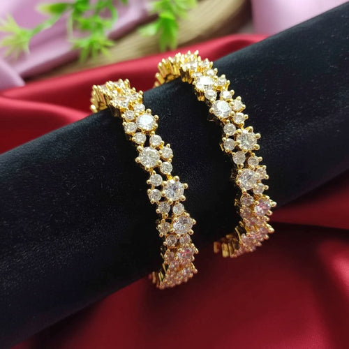 Shangri gold polish American Diamond bangles featuring sparkling stones in an elegant pattern for festive wear.