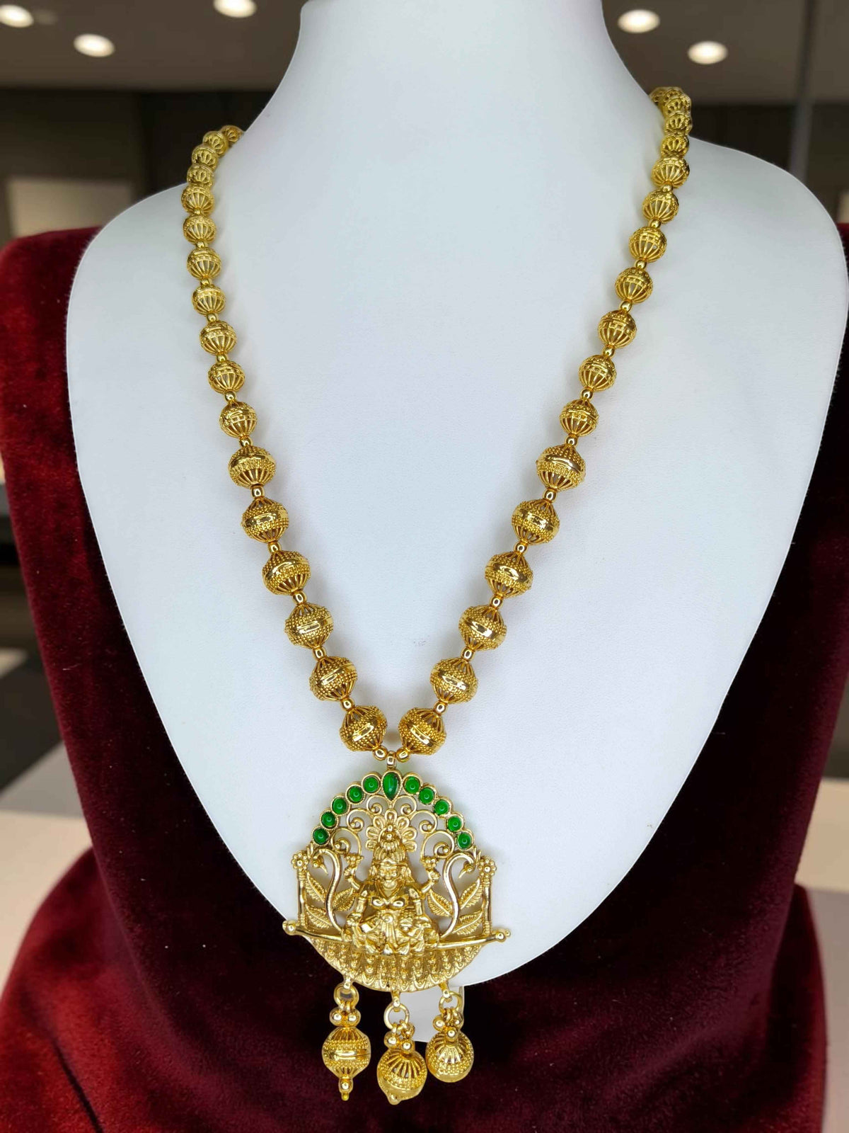 Gold Plated Lakshmi Temple Necklace Set with Green Stone Accents