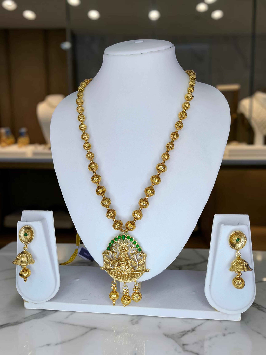 Gold Plated Lakshmi Temple Necklace Set with Green Stone Accents
