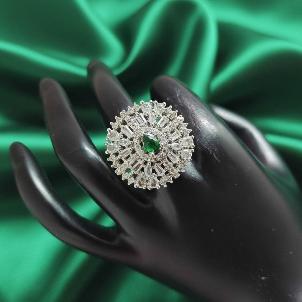 Shangri American Diamond floral halo ring with a green pear-cut center stone on a black display hand
