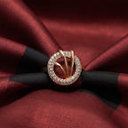 Shangri rose gold plated circular halo ring featuring sparkling American Diamond stones and interlaced gold accents.