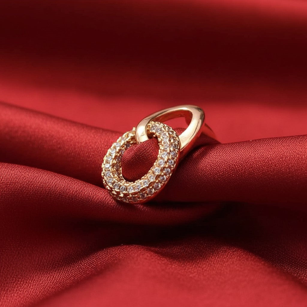 Shangri rose gold plated interlinked ring featuring one polished loop and one loop encrusted with Austrian stones.