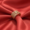 Shangri rose gold plated layered band ring featuring rows of sparkling Austrian crystals on a red satin background
