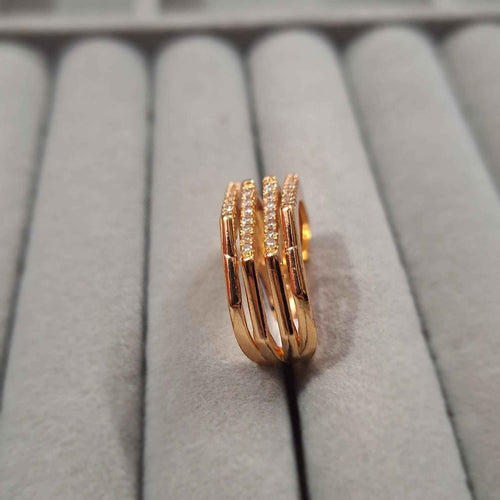 Shangri rose gold plated multi-band ring featuring sparkling Austrian stones on a grey velvet jewellery display.